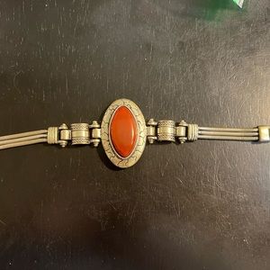 ONE PRE-OWNED 7-1/2” SILVERTONE AND RED STONE BRACELET CTM1